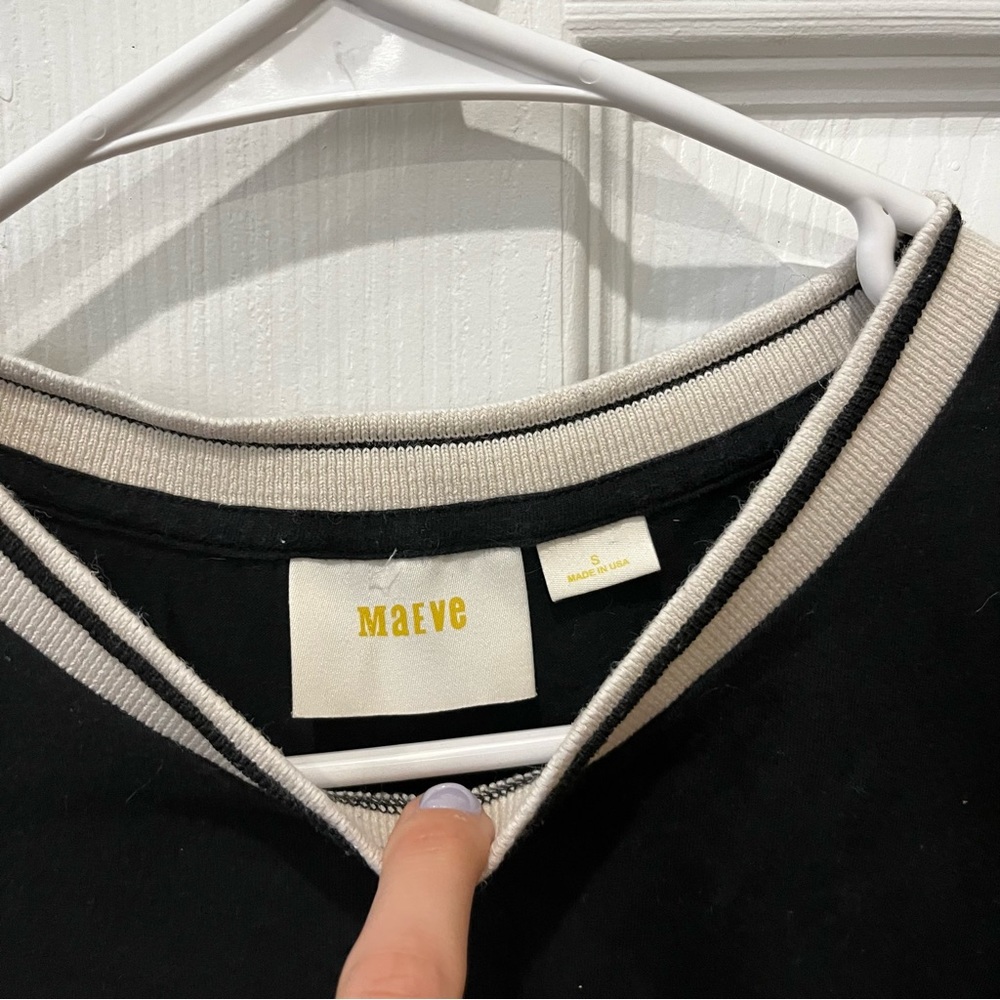 Black shirt with white collar